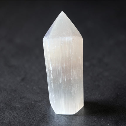Selenite semi-polished crystal point for energy cleansing and spiritual clarity from Raven's Cauldron, 6 N Sandusky St, Delaware, OH 43015
