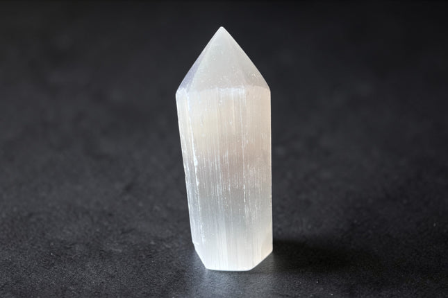 Selenite semi-polished crystal point for energy cleansing and spiritual clarity from Raven's Cauldron, 6 N Sandusky St, Delaware, OH 43015