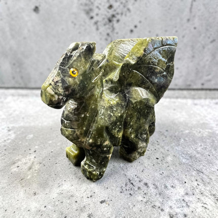 Hand-carved Serpentine Dragon crystal carving measuring approximately 2.75 inches, featuring natural green serpentine with detailed dragon craftsmanship for crystal collections, meditation, and altar décor.