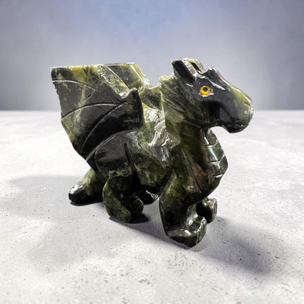 Hand-carved Serpentine Dragon crystal carving measuring approximately 2.75 inches, featuring natural green serpentine with detailed dragon craftsmanship for crystal collections, meditation, and altar décor.