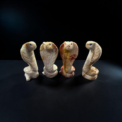 Hand-carved natural soapstone snake carving measuring approximately 2.75 inches, symbolizing transformation, wisdom, healing, and renewal.