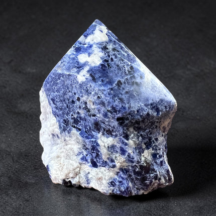 Sodalite semi-polished crystal point for intuition and throat chakra energy from Raven's Cauldron, 6 N Sandusky St, Delaware, OH 43015