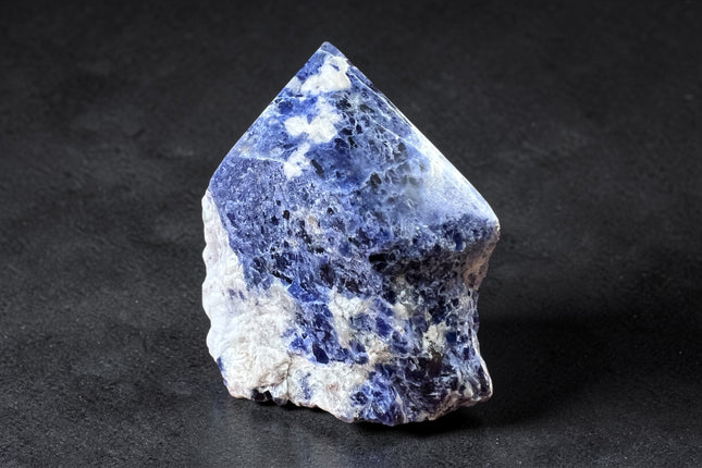 Sodalite semi-polished crystal point for intuition and throat chakra energy from Raven's Cauldron, 6 N Sandusky St, Delaware, OH 43015