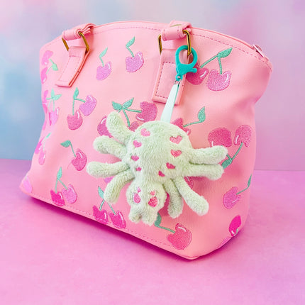Creepy cute pastel goth spider plush bag charm keychain by Kawaii Hair Candy shown on bag