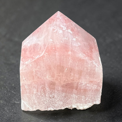 Strawberry Calcite semi-polished crystal point for self-love and heart chakra energy from Raven's Cauldron, 6 N Sandusky St, Delaware, OH 43015
