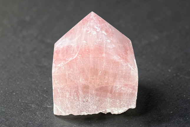 Strawberry Calcite semi-polished crystal point for self-love and heart chakra energy from Raven's Cauldron, 6 N Sandusky St, Delaware, OH 43015