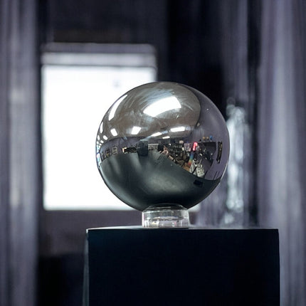 Metallic sphere on a stand with blurred background terahertz sphere ,Ravens Cauldron, 6 N Sandusky St, Delaware, OH 43015