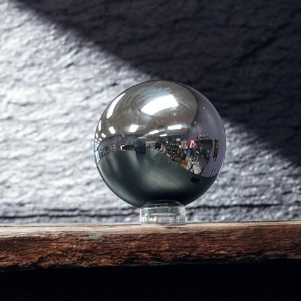 Metallic sphere on a stand with a dark textured background terahertz sphere ,Ravens Cauldron, 6 N Sandusky St, Delaware, OH 43015