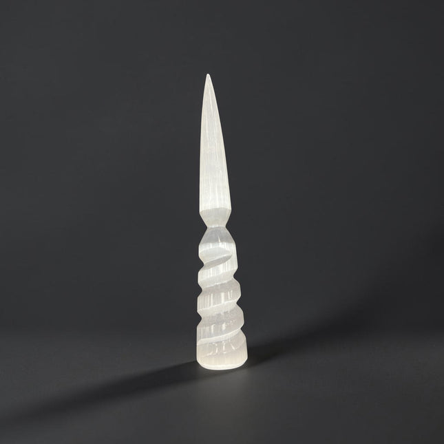 Natural 7 to 8 inch Selenite crystal wand with carved spiral base for energy cleansing, meditation, Reiki, crystal charging, and altar display from Raven's Cauldron.