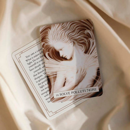 The White Light Oracle Pocket Edition by Alana Fairchild featuring 44 oracle cards with artwork by A. Andrew Gonzalez, mini boxed deck published by Llewellyn, Raven's Cauldron, Delaware, OH